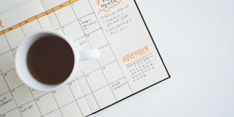 Cup of coffee with calendar